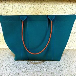 Rothy’s Essential Tote. Teal and neon orange
